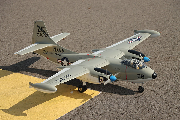Model military aircraft on display at an outdoor setting.