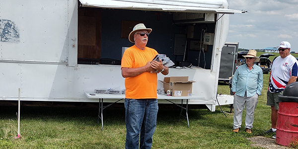 The Quadfecta's illustrious CD, Wally “by Golly” Adasczik, preparing the awards ceremony.