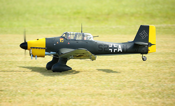 A model of a World War II-era fighter plane on grass.