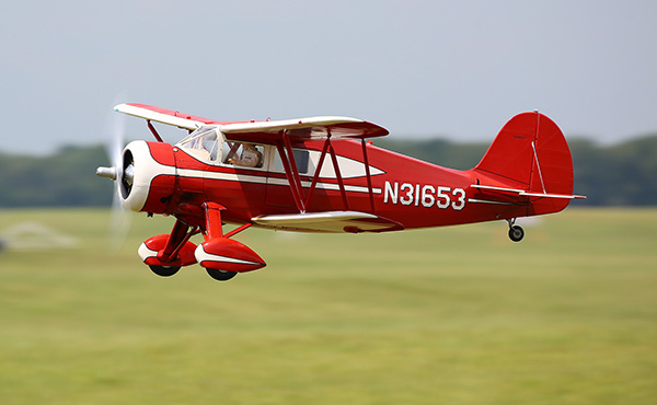 Charlie Nelson’s Waco in flight on its way to winning one more contest.