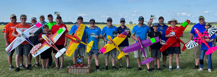 Winners and their trophies, L-R: Gary Schmidt (caller for Jim Allen; fourth), Glenn Lang (third in Standard) with caller Trey Wi