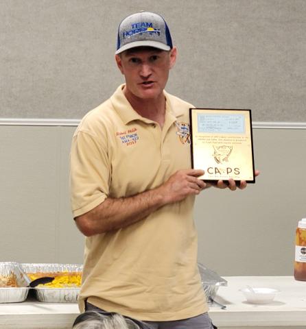 Robert Holik accepts the plaque to commemorate a donation for Crash Fund, Inc., on behalf of Annie Torres. Robert Holik accepts the plaque to commemorate a donation for Crash Fund, Inc., on behalf of Annie Torres.
