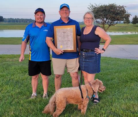Dan Kane holding his AMA Hall-of-Fame induction plaque with son Jack, wife Catherine and Finnegin. Dan Kane holding his AMA Hall-of-Fame induction plaque with son Jack, wife Catherine and Finnegin.