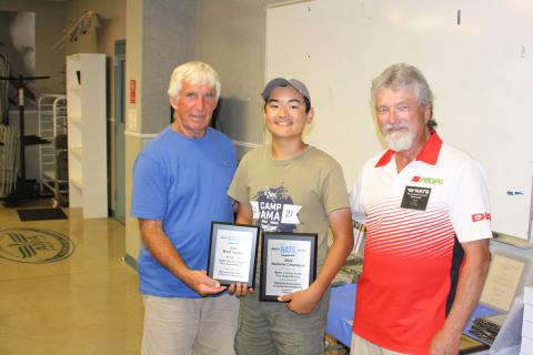 NASA President Mike Barbee and VP Steve Eagle present the Best Junior and 1st place trophies to Kaleb Spencer Saturday night.
