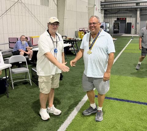 Dave Lindley presents Don Slusarczyk with the Cabin Award.