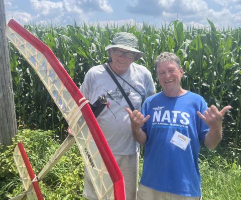 Chuck Powell (R) helped Denny Dock fish his Jays’ Bird out of the corn.