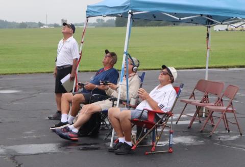 Judges scoring flights after the weather delay.