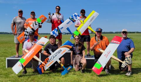 Your podium finishers (front row L to R) Jason Duda - 5th place, Dominic Del Ponte - Best Junior, Annabelle Doe - Best Senior, Pilot A.J. Seaholm and caller Lonnie Smith - 4th place. (Back row L to R) caller Ray Brown and pilot Dean Stone - 3rd place, Matthew Fehling and caller Jacob Raquet - 1st place and 2nd place, respectively. Your podium finishers (front row L to R) Jason Duda - 5th place, Dominic Del Ponte - Best Junior, Annabelle Doe - Best Senior, Pilot A.J. Seaholm and caller Lonnie Smith - 4th place. (Back row L to R) caller Ray Brown and pilot Dean Stone - 3rd place, Matthew Fehling and caller Jacob Raquet - 1st place and 2nd place, respectively.