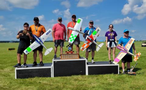 (L to R) Best Junior Dominic Del Ponte, 2nd Place and Fast Time Gino Del Ponte, Glenn Lange caller, 1st Place Chris Martin, 3rd Place Dan Kane, Best Senior Annabelle Doe, Jack Kane holding Best Of Show EF1 by Dan Kane.