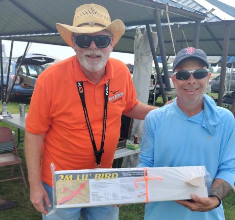Scott Black of Sky Bench Aerotech presents raffle winner, Fred Maier, with a Little Bird. Scott Black of Sky Bench Aerotech presents raffle winner, Fred Maier, with a Little Bird.