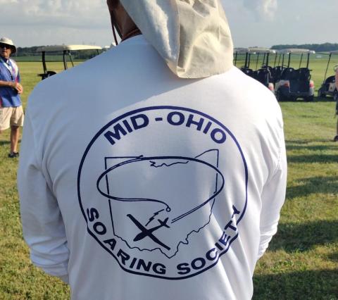 Back of person in white shirt with "Mid-Ohio Soaring Society" logo.