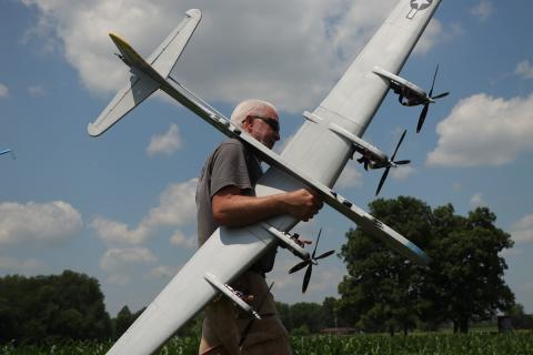 Fred Cronenwett carrying his B-29 that was flown in Profile Scale.
