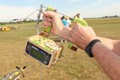 Stephen demonstrating how to hold the handle with both hands. He can reach down with his second hand to move anything on the box below.