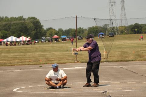 Steve Kretschmer flying the model. Notice the land location.