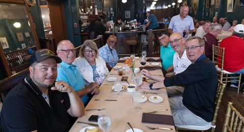 Johnny Gago, Joe Winterrowd, Joy & Mike Murphy, Mark Doucey, Event Director Bob Kane, and Chief Scorekeeper Peter VanHeusden enjoying the evening. (Jon Dieringer photo)