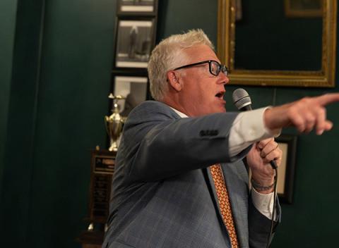 NSRCA D5 VP Rusty Dose warming up the audience for the auction of a jet aircraft kit donated by Horizon Hobby Distributors. (Jon Dieringer photo)