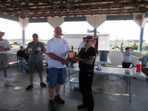 Sparky (R) receives his Concours d'Elegance award from John Paris (L).