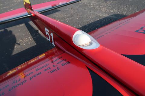 The pilot just peeking over the instrument panel.